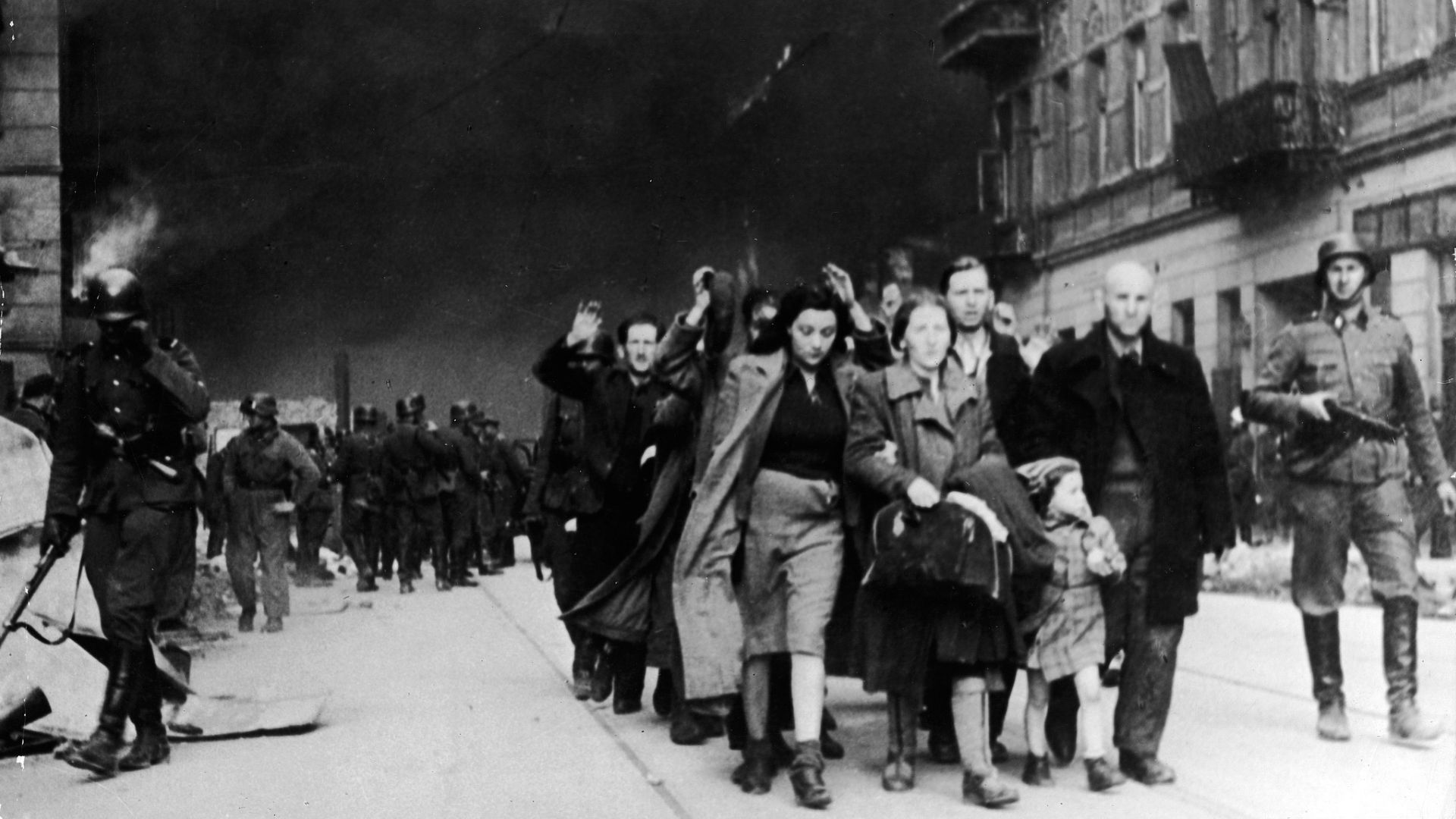 Captured Jewish civilians who participated in the Warsaw Ghetto Uprising are marched out of the city by Nazi troops on April 19, 1943. /Frederic Lewis/Getty Images
